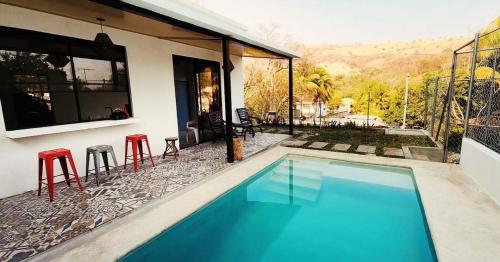 Piscina a Villa Palmarcito o a prop