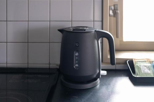 a tea kettle sitting on a counter in a kitchen at WeskiiHotel in Kanazawa