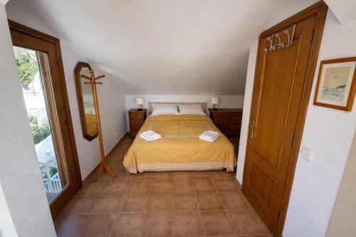 a small bedroom with a bed in a room at Aucanada Love Nest in Alcudia
