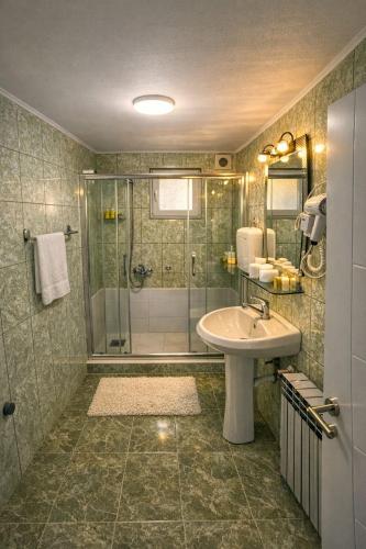 a bathroom with a shower and a sink at Babiko DTM 037 in Čitluk