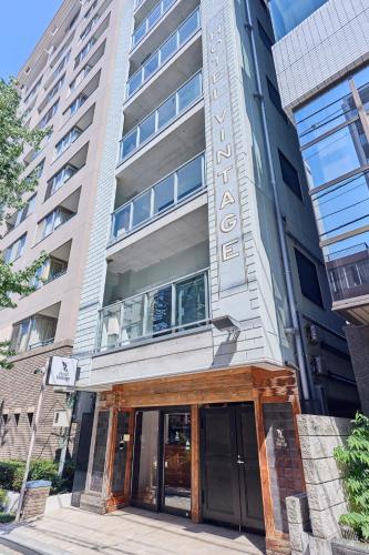 a building with a sign on the front of it at Hotel Vintage Tokyo Kagurazaka in Tokyo
