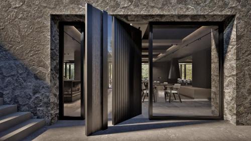 a house with glass doors leading to a dining room at Neme Slow Living Retreat in Rethymno