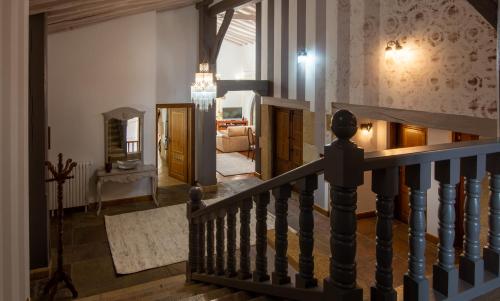a staircase in a house with a living room at Luxury Villa Esmeralda in Suances