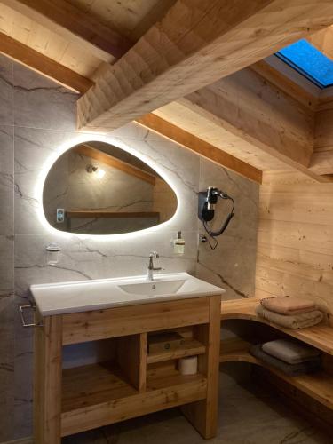 a bathroom with a sink and a mirror at Vertigo in Puy-Saint-Pierre
