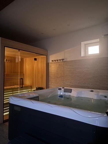 a large bath tub in a room with at Čuružanka in Čurug