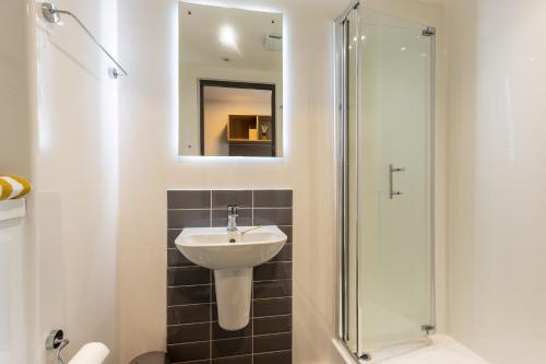 a bathroom with a sink and a shower at Argyl - Broga House Central Cork Accommodation in Cork
