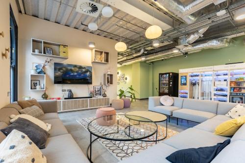 a living room with couches and tables at Argyl - Broga House Central Cork Accommodation in Cork