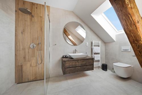 a bathroom with a sink and a mirror at Blatenský dvůr in Pardubice