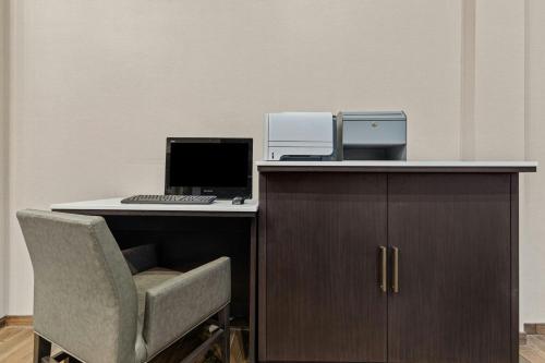 an office with a desk with a computer and a chair at Residence Inn Paducah in Paducah