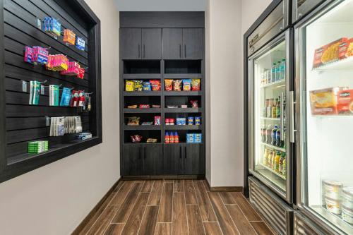 a kitchen with a refrigerator filled with lots of food at Residence Inn Paducah in Paducah
