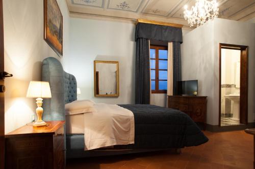 Giường trong phòng chung tại Relais Villa Scarfantoni B&B