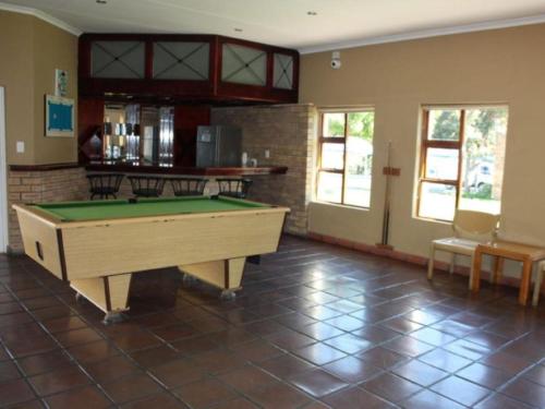 a living room with a pool table in it at Amies Self-Catering Apartments in Panorama