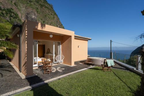 a villa with a view of the ocean at Casa da Fajã do Amo Sea view and Jacuzzi in São Vicente