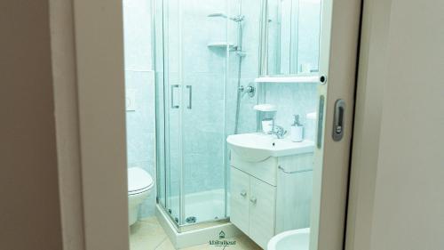 a bathroom with a shower and a sink and a toilet at I Portici - Cernobbio in Cernobbio