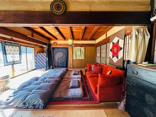 a large bed in the middle of a rv at Family Homestay Shirokuro Guesthouse in Nakakiri