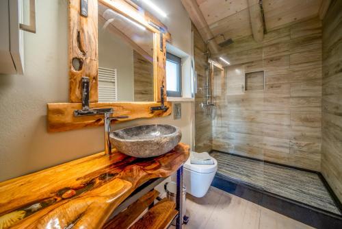 a bathroom with a wooden counter with a sink at Villa Irida by Elayan Villas Corfu in Sidari