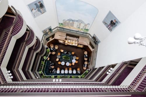 an overhead view of the lobby of a building at Hôtel Paris Neuilly in Neuilly-sur-Seine