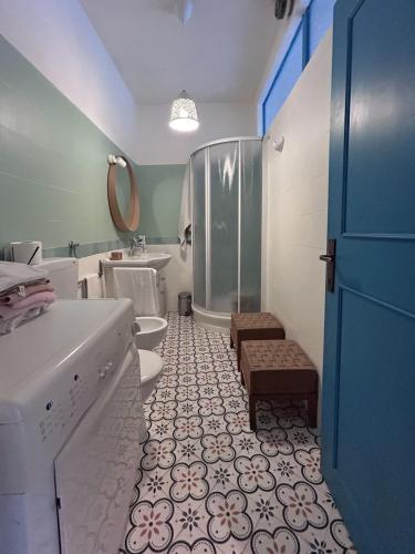 a bathroom with a shower and a toilet and a sink at Casa Laura in Modigliana