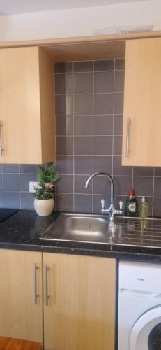 a kitchen with a sink and a counter top at Banbury causeway in Banbury