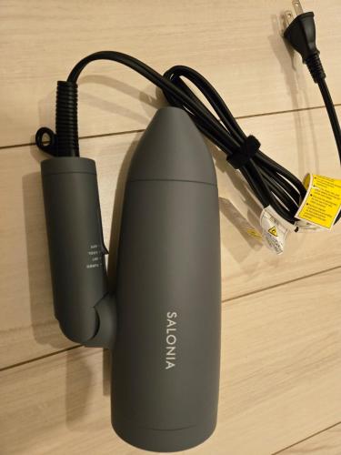 a router with a charger on a table at Karawaru Stay 亀有 A102 in Tokyo