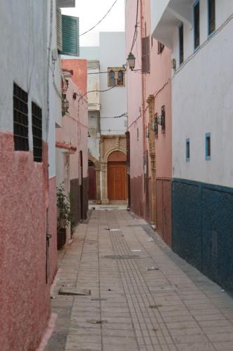 an alley with a door in an old building at Riad Dar Karima in Rabat
