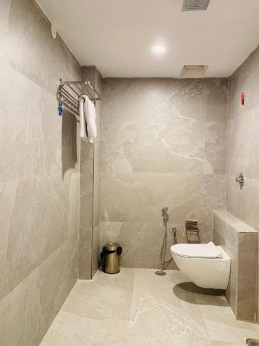 a bathroom with a sink and a toilet in it at Hotel Ananta in Sasarām