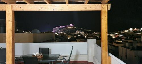 a view of a city at night from a balcony at La Azotea - By Aloha Palma in Águilas