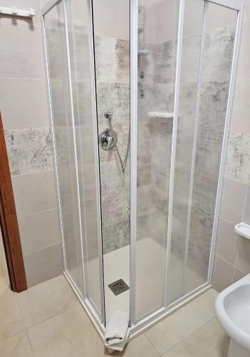 a shower with a glass door in a bathroom at Torre Sant'Irene Club in Sant'Irene-Briatico