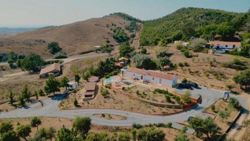 an aerial view of a house on a hill at Monte da Serra de Baixo By CABRA in Sines