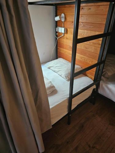 a bunk bed in a room with a bunk bedutenewayangering at Hostel Hostel in Batumi
