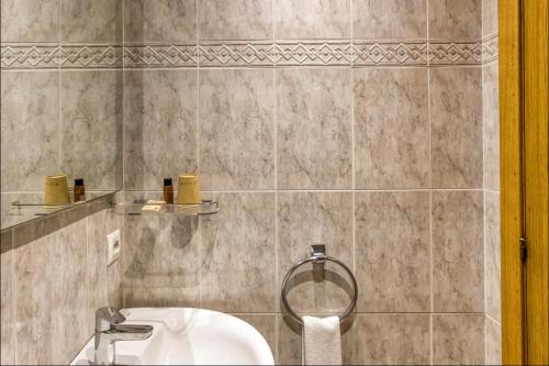 a bathroom with a toilet and a sink at Hostal La Barretina in Figueres