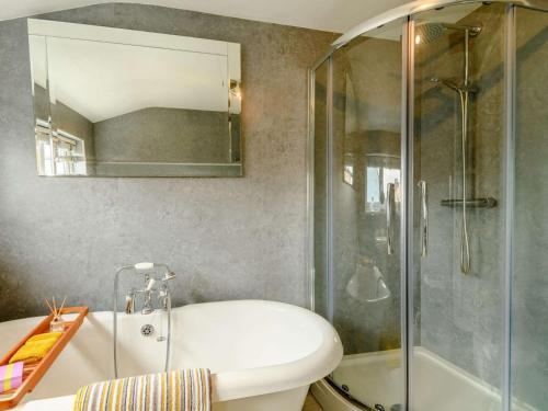 a bathroom with a shower and a white sink at 2 Bed in Milford Haven oc-88529 in Milford Haven