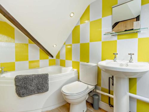 a bathroom with a toilet and a sink at 2 Bed in Corwen oc-77351 in Corwen