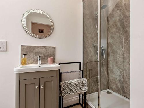 a bathroom with a sink and a shower at 5 Bed in Denbigh oc-86009 in Llandyrnog