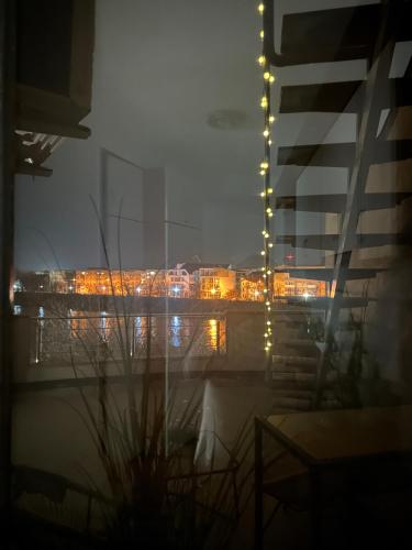 a view of a city at night with lights at Rotonda apartment in Lugoj