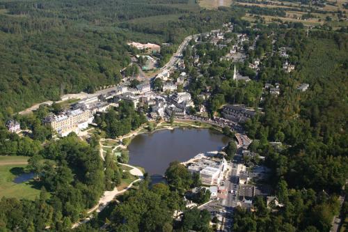 an aerial view of a city with a lake at Hôtel Spa Du Béryl in Bagnoles de l'Orne