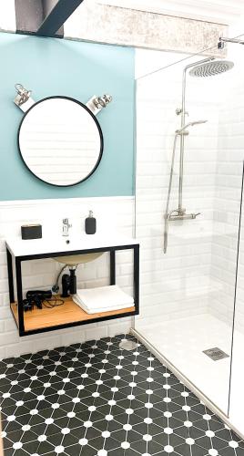 a bathroom with a sink and a mirror at Casa Encina in Murcia