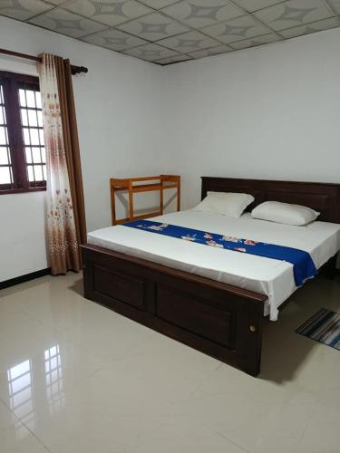 a bedroom with a large bed in a room at Green Serenity Villa in Ahangama