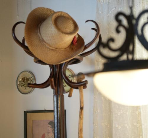 a cowboy hat sitting on top of a pole at Aphrodite's Coast Retreat House! in Galaxidi
