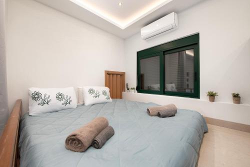 Loft 146 tesisinde bir odada yatak veya yataklar