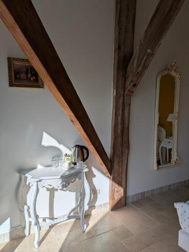 a white table in a room with a mirror at Boutique Hotel Westerlee in Westerlee