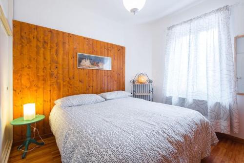 A bed or beds in a room at Appartamento Ciliegio Le Regine