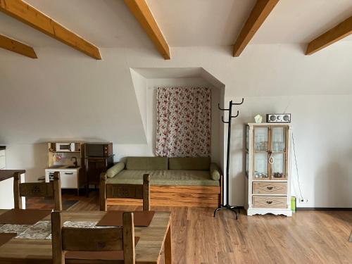 a living room with a bed and a table at FEWO Elbe Weser in Hipstedt