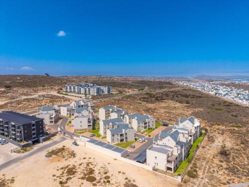 an aerial view of a building in the desert at Sunset Heights in Langebaan