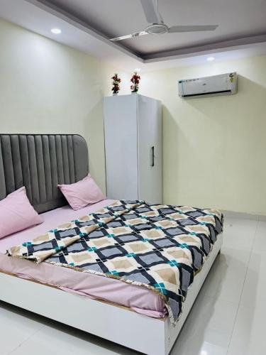 a bedroom with a bed in a room at Hotel Crystal Haven in New Delhi