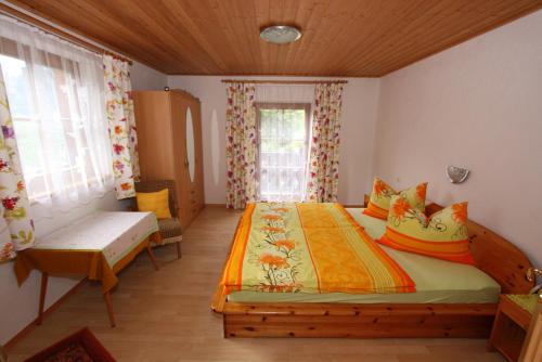 A bed or beds in a room at Plattnerhof