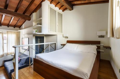 a small bedroom with a bed and a window at Corso Double in Florence