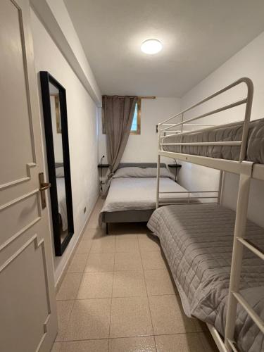 a room with two bunk beds and a door at CASA ELISA in Cavo