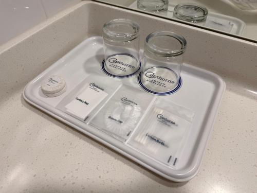 a tray with four glass jars on top of a counter at Copthorne Hotel Cameron Highlands in Cameron Highlands