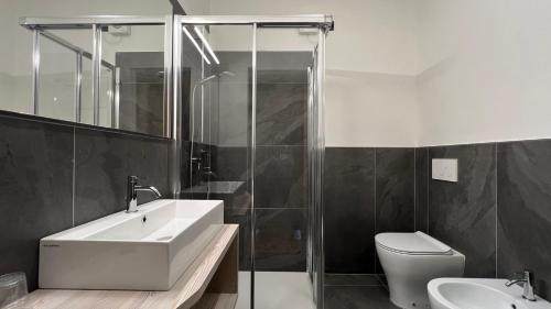 a bathroom with a sink and a toilet at Hotel Vezzena in Malga Postesina